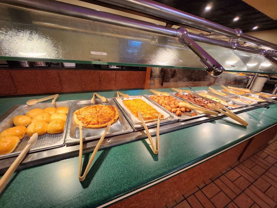 Comfort food buffet under warm lights